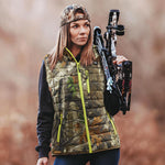 a woman wears heated vest for hunting 